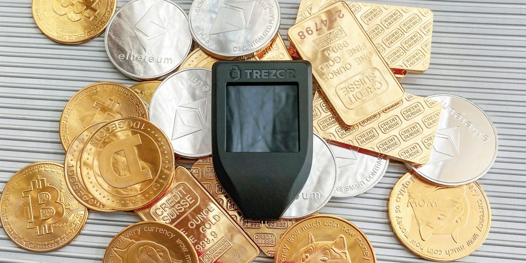 a cell phone sitting on top of a pile of coins